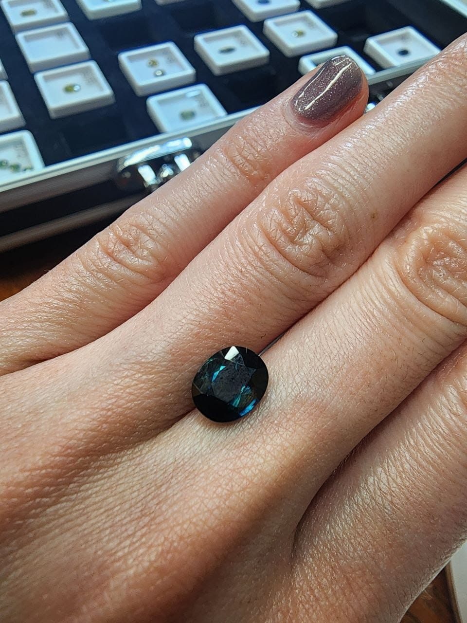 Blue-Green Australian Sapphire 2.21ct Oval — actual stone, photographed on the hand for scale — Ministry of Gems (view 3)