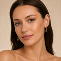 Model wearing the Woven Light australian opal earrings in 14K Gold — Ministry of Gems