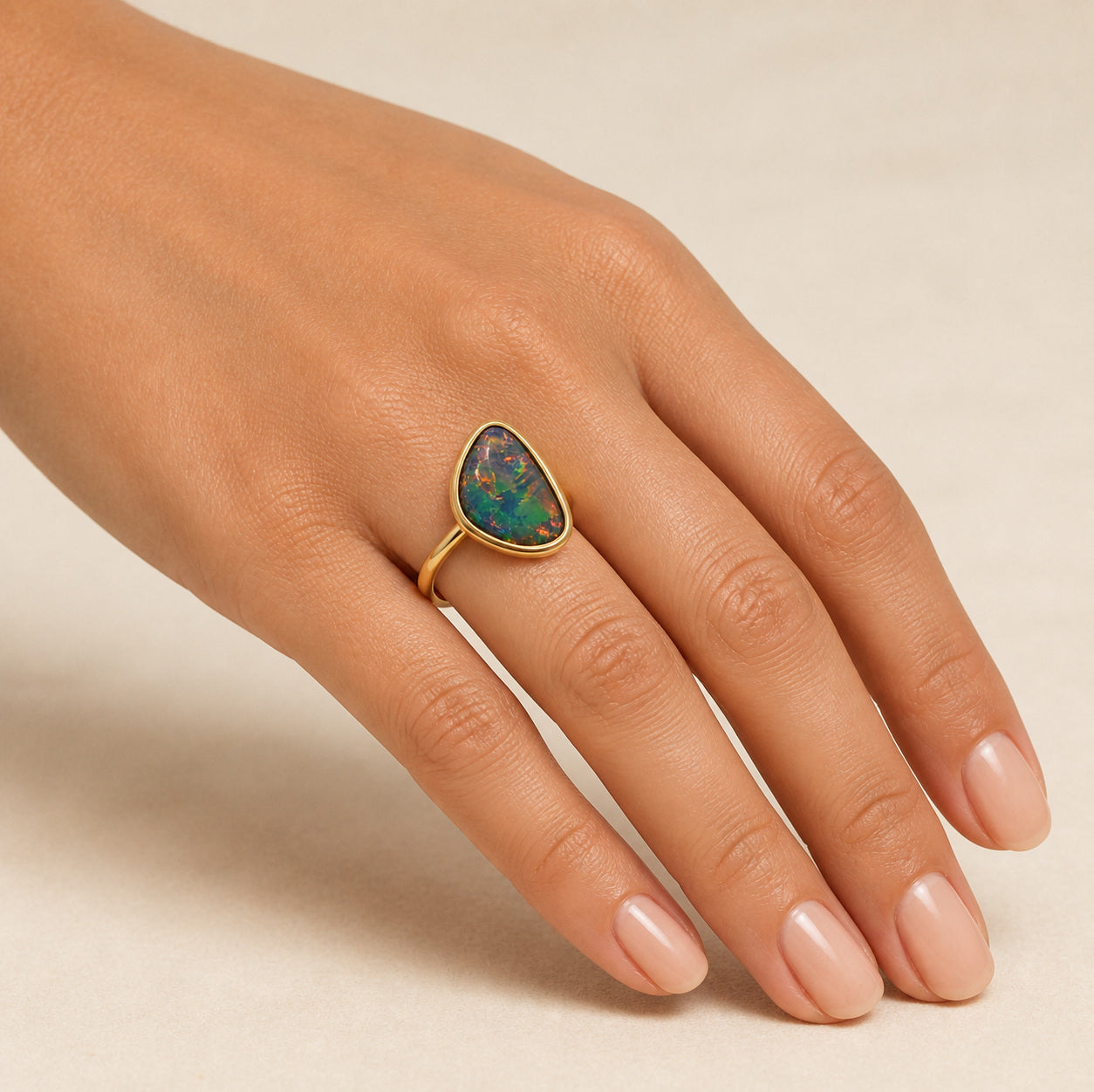 Model wearing the The Conversation Stone boulder opal ring in 9K Gold — Ministry of Gems