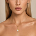 Model wearing the Lantern Oval IV australian opal pendant in Gold-Plated Sterling Silver — Ministry of Gems