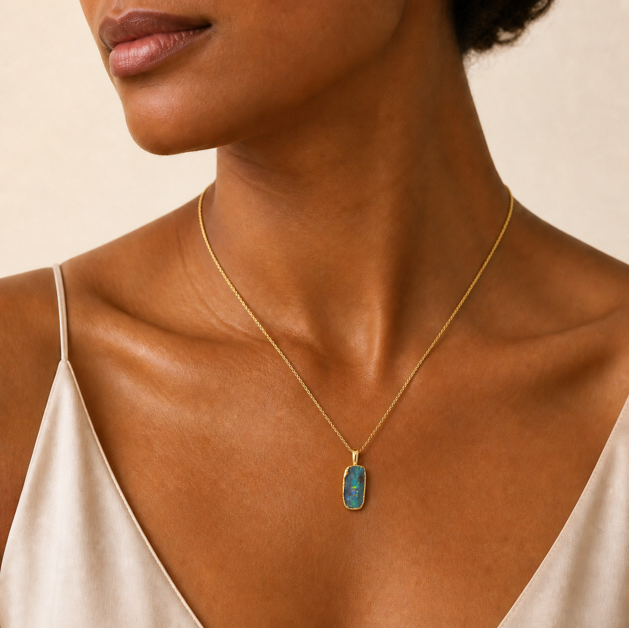 Model wearing the Strata I boulder opal pendant in Gold-Plated Sterling Silver — Ministry of Gems