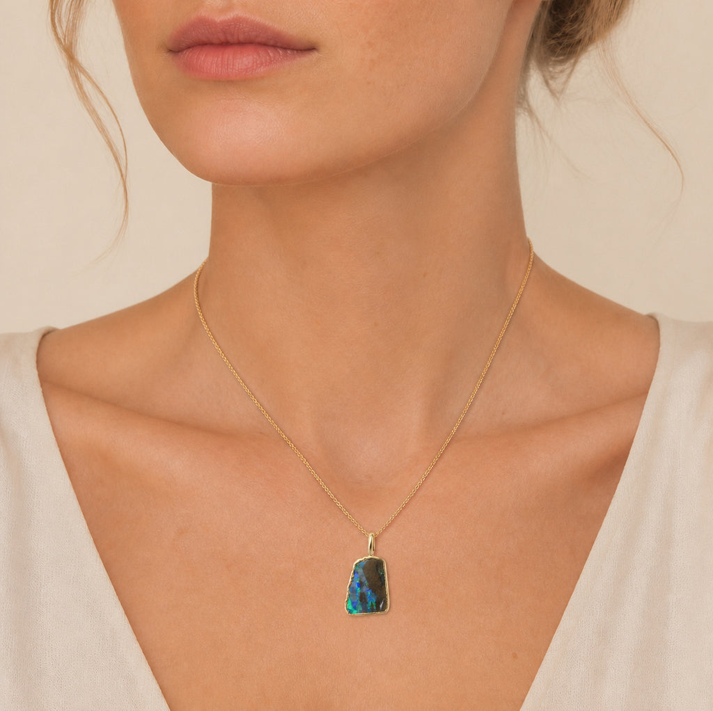 Model wearing the Strata III boulder opal pendant in Gold-Plated Sterling Silver — Ministry of Gems
