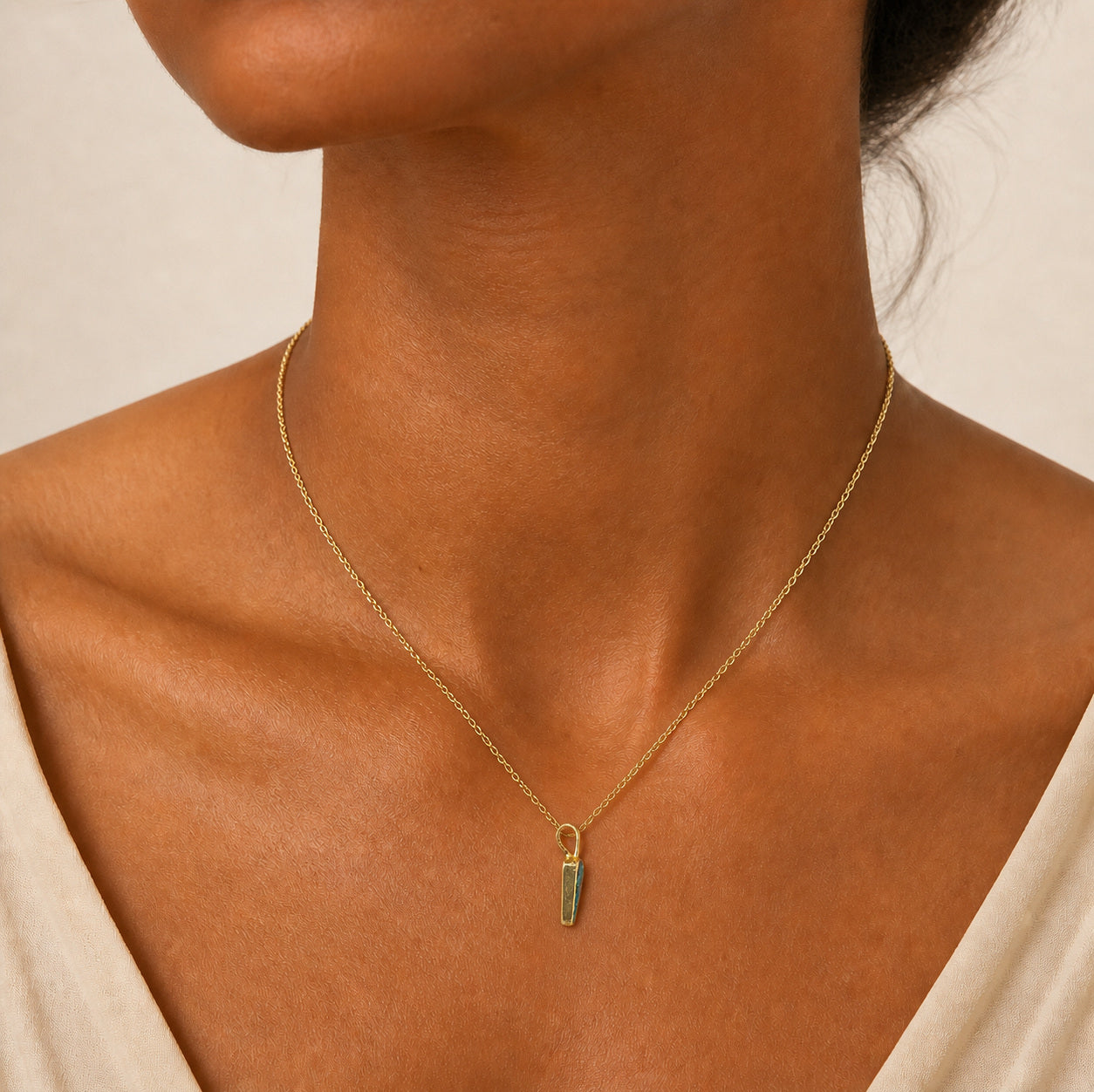 Model wearing the Strata IV boulder opal pendant in Gold-Plated Sterling Silver — Ministry of Gems