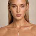 Model wearing the Suspended Pear I australian opal pendant in Gold-Plated Sterling Silver — Ministry of Gems