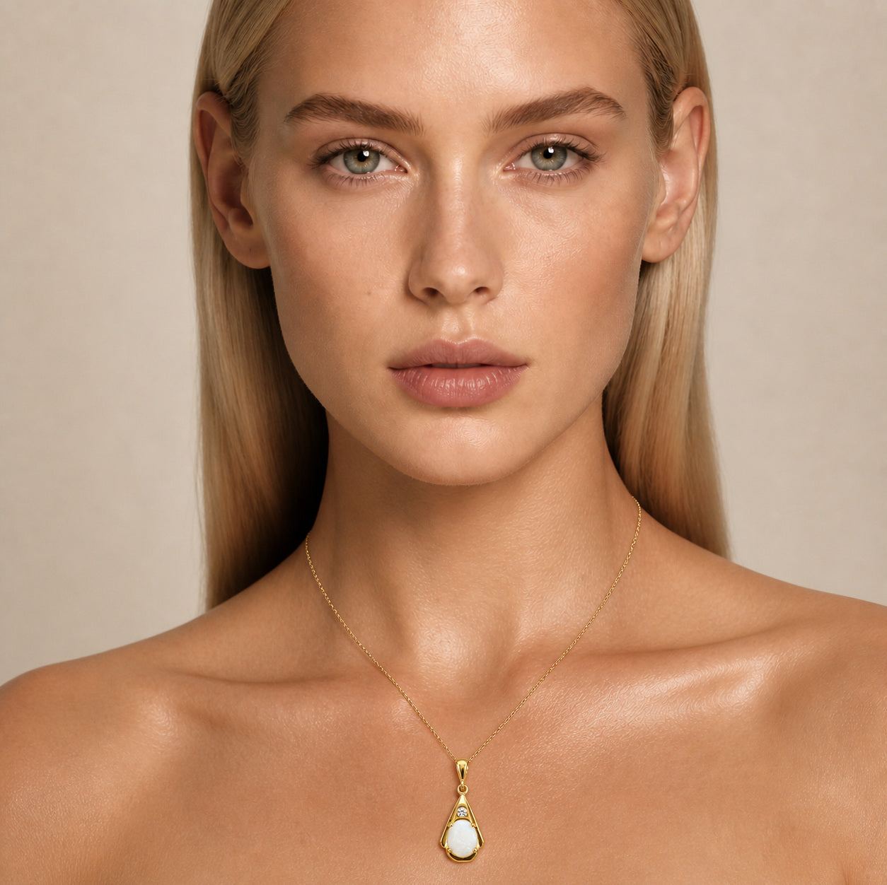 Model wearing the Suspended Pear I australian opal pendant in Gold-Plated Sterling Silver — Ministry of Gems