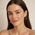 Model wearing the Pale Cascade australian opal earrings in 14K Gold — Ministry of Gems