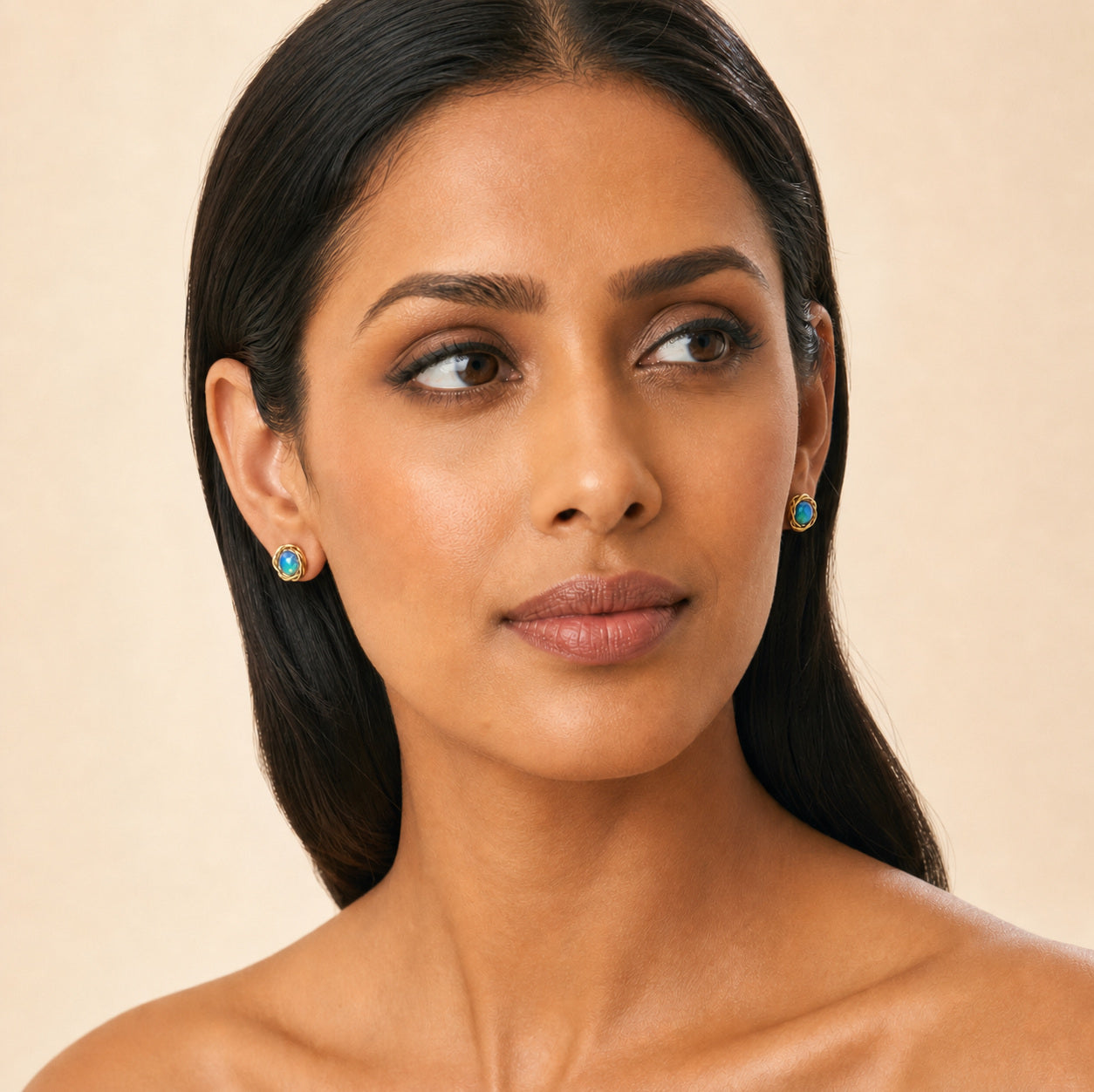 Model wearing the Daylight Ember australian opal earrings in 14K Gold — Ministry of Gems