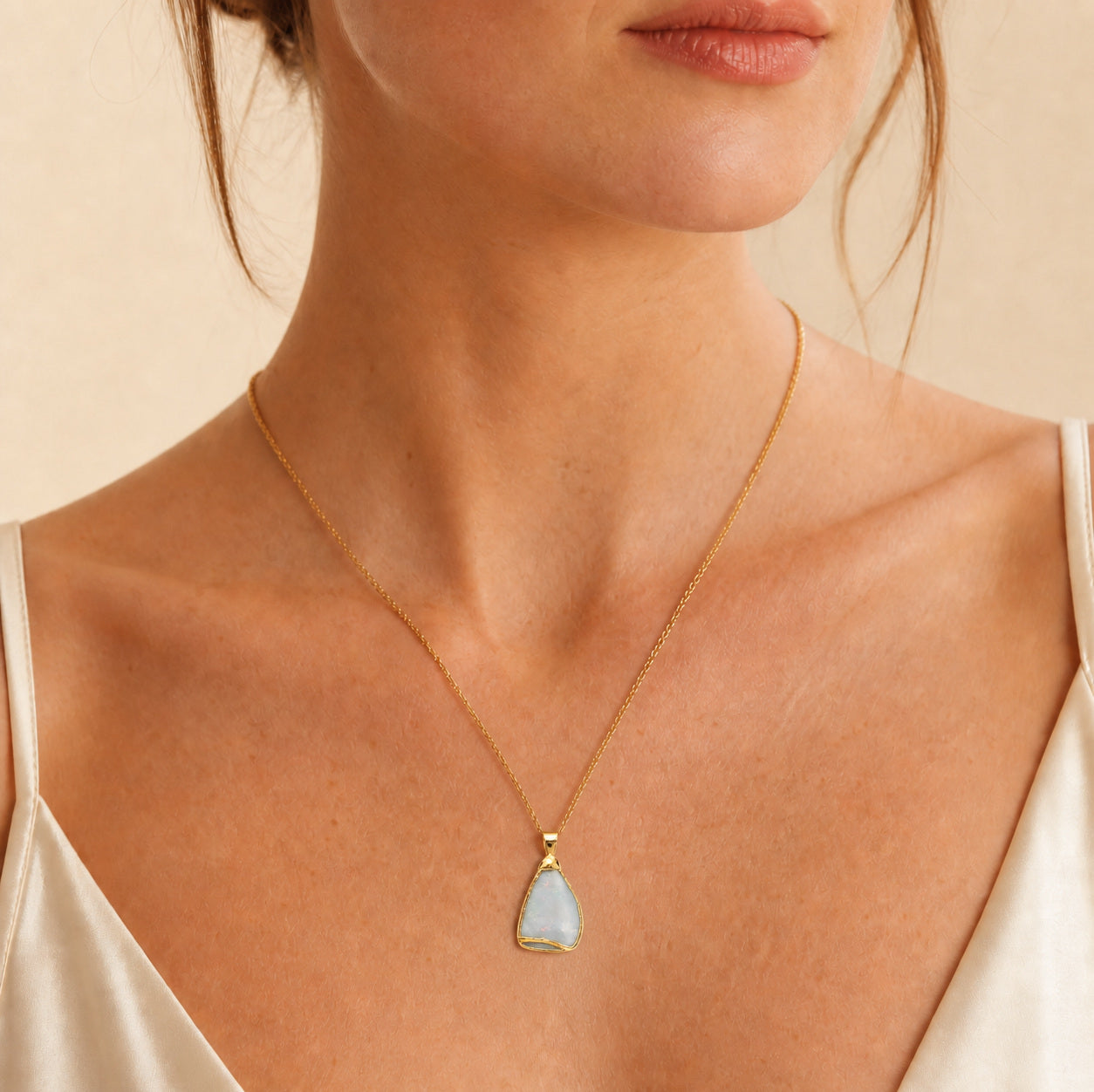 Model wearing the Boulder Shard II boulder opal pendant in Gold-Plated Sterling Silver — Ministry of Gems